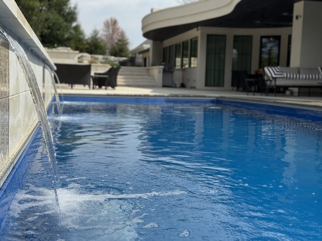 Sheer water descending into a pool